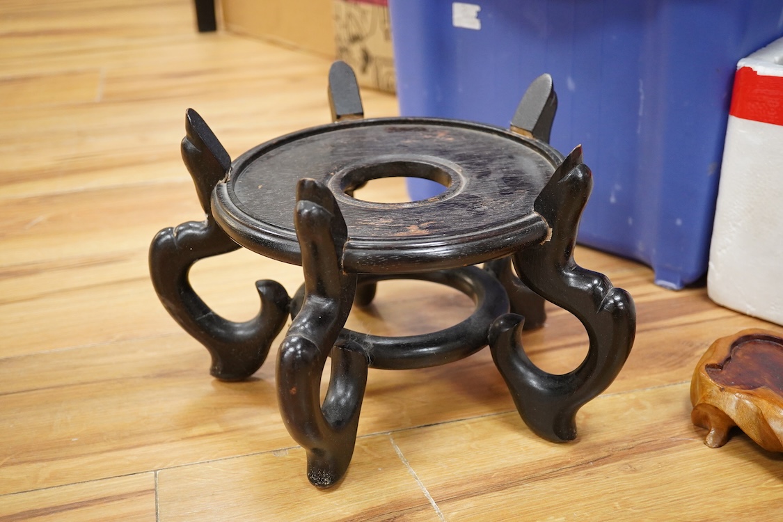 A large collection of Chinese hardwood stands, including a pair 24cm diameter x 18cm high